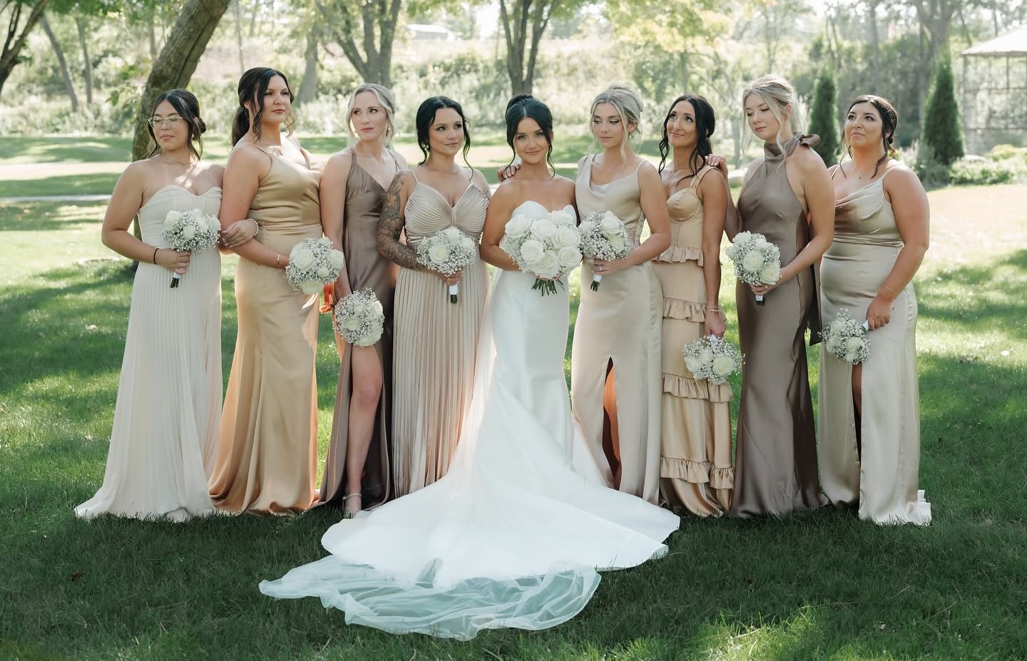 Bride standing at the center of her bridesmaids